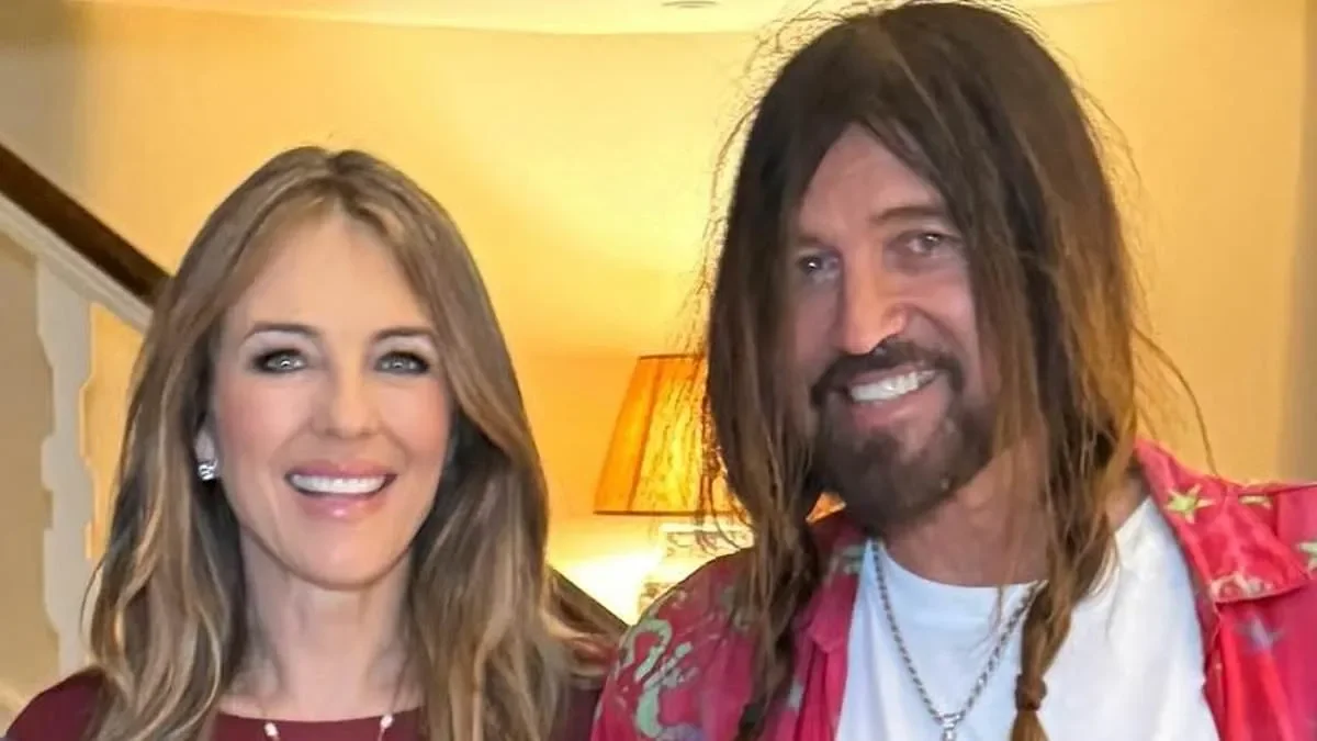 Elizabeth Hurley and Billy Ray Cyrus share a passionate kiss as actress supports singer at country music festival Stagecoach - 2