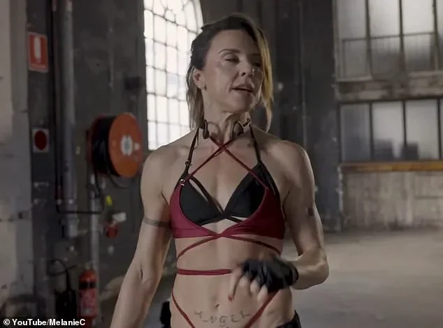 Mel C shows off her Sporty Spice physique as she flashes her toned midriff in a bra top while on stage - 3