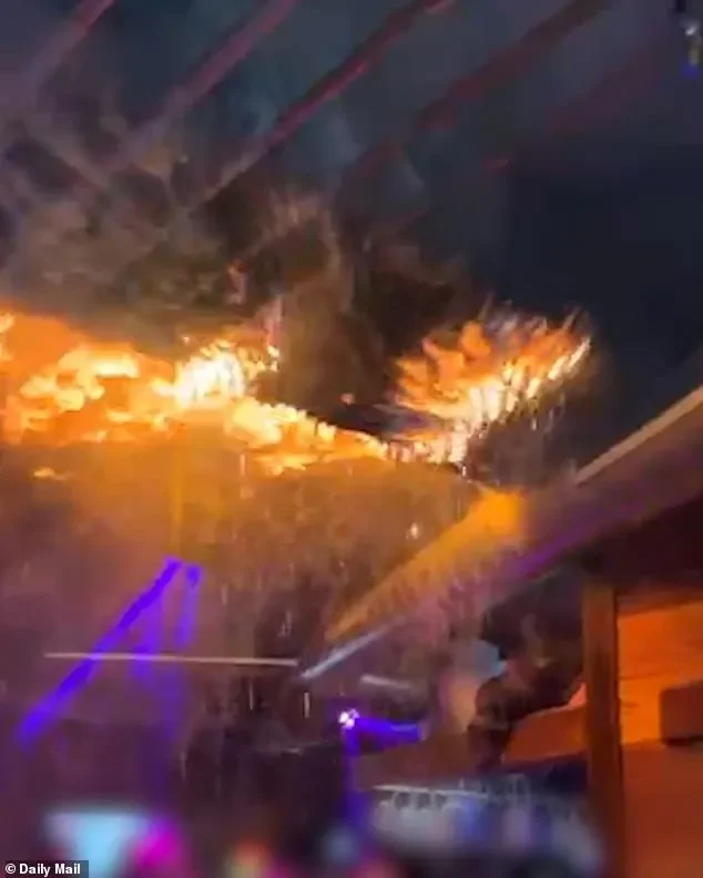 Furious families ATTACK owners of Swiss inferno nightclub where youngsters burned to death: Terror is etched on female manager's face as parents scream 'you killed my son - you'll pay for this' - 3