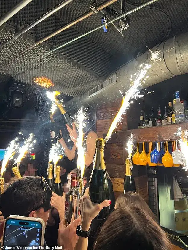 Furious families ATTACK owners of Swiss inferno nightclub where youngsters burned to death: Terror is etched on female manager's face as parents scream 'you killed my son - you'll pay for this' - 2