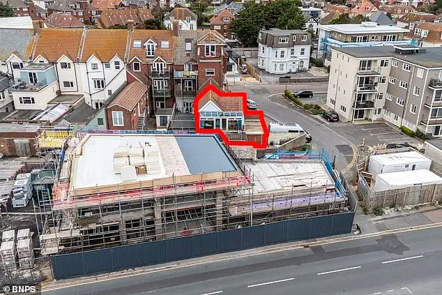 Mother whose sea view was blocked by illegal wall is shocked as council back developers who built it - 1