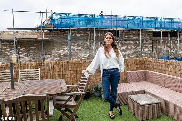 Mother whose sea view was blocked by illegal wall is shocked as council back developers who built it - 3