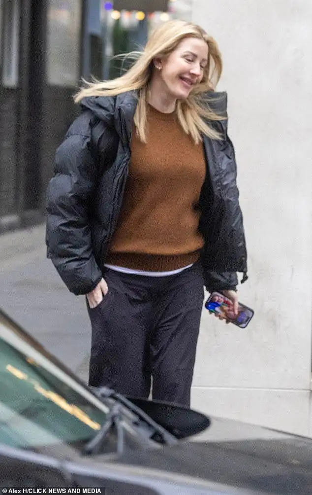 Ellie Goulding offers a rare glimpse of baby daughter Iris as she shares a candid snap of her breastfeeding - 3