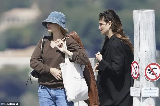 Margot Robbie keeps a low profile in a bucket hat as she enjoys a luxury day out with pal Phoebe Tonkin at celebrity hotspot Club 55 in Saint-Tropez - 4
