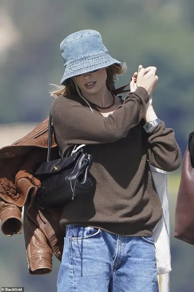 Margot Robbie keeps a low profile in a bucket hat as she enjoys a luxury day out with pal Phoebe Tonkin at celebrity hotspot Club 55 in Saint-Tropez - 2
