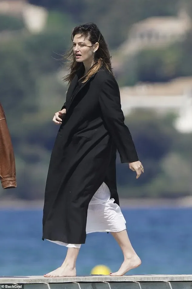 Margot Robbie keeps a low profile in a bucket hat as she enjoys a luxury day out with pal Phoebe Tonkin at celebrity hotspot Club 55 in Saint-Tropez - 1
