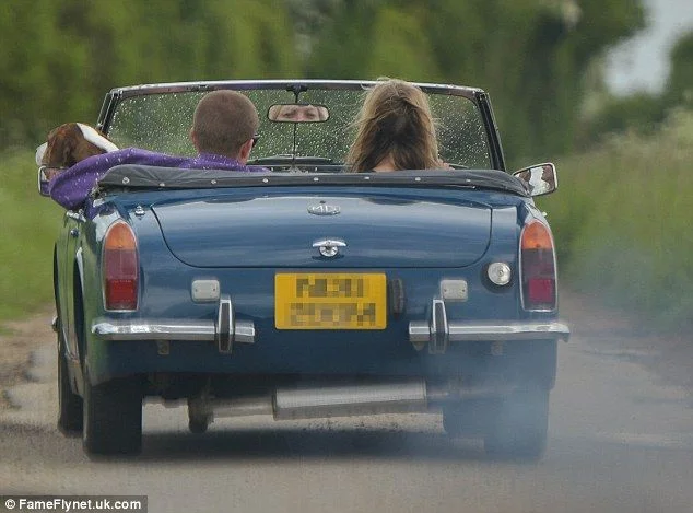 Kate Moss indulges her love of vintage cars as she is spotted zipping around London in classic British convertible - 3