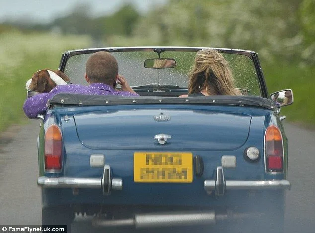 Kate Moss indulges her love of vintage cars as she is spotted zipping around London in classic British convertible - 2