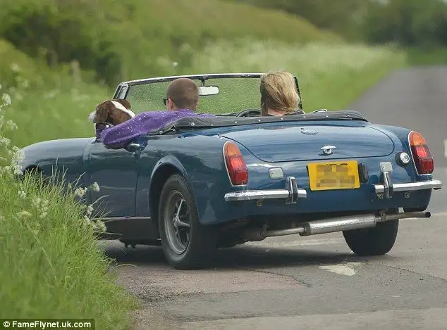 Kate Moss indulges her love of vintage cars as she is spotted zipping around London in classic British convertible - 4