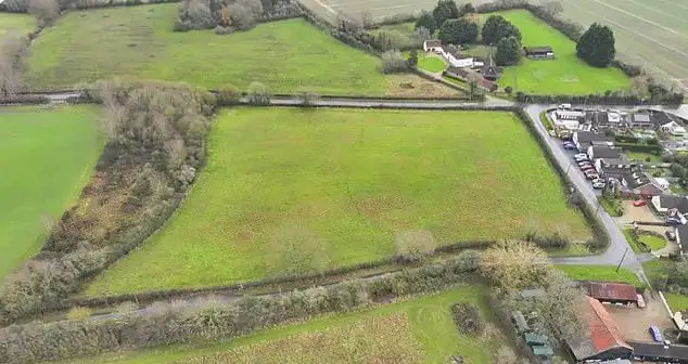 Travellers start work turning wildlife haven into caravan site within hours of council closing its doors for three-day Bank Holiday weekend - 3