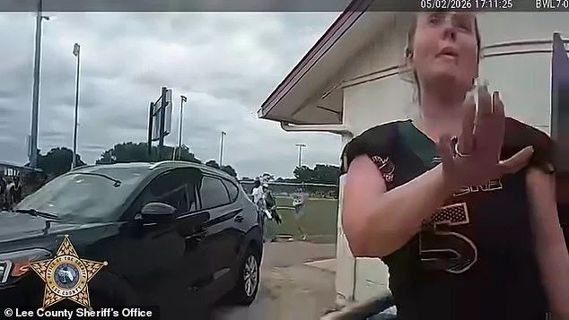 Florida mom's foul-mouthed arrest caught on camera as she is detained for 'storming the field and kicking a child' during youth football game - 1