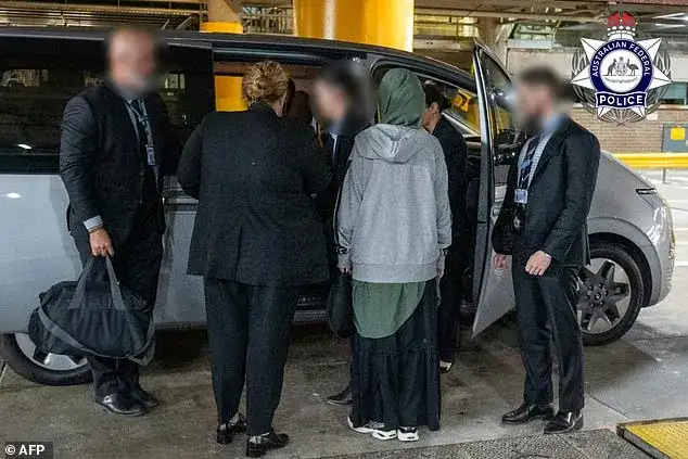 ISIS bride taken in by AFP on landing - 2