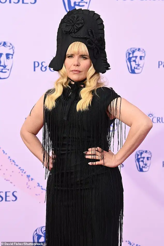 Amanda Holden flaunts her incredible figure in an ab-flashing grey look as she joins pregnant Vogue Williams and newly-single Millie Mackintosh on the red carpet at the 2026 BAFTA TV Awards - 2