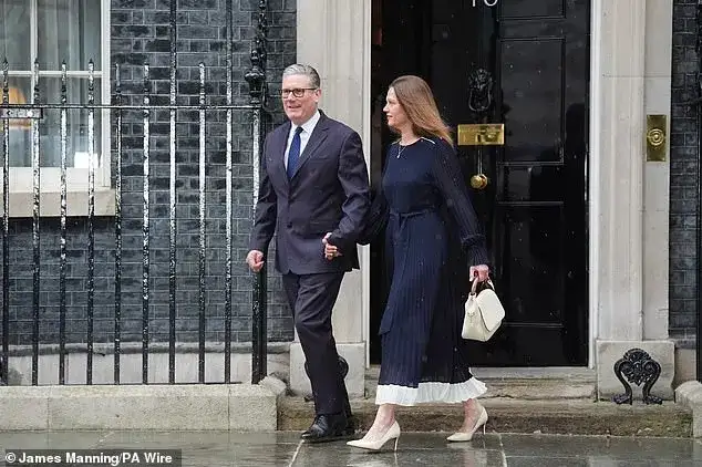Keir Starmer 'looked like boy being taken off for his first day at school' as he clutched wife's hand on way to King's Speech - 1