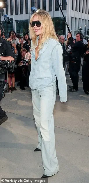 Miley Cyrus is shockingly under-dressed in double denim at starry Dior Cruise fashion show with Sabrina Carpenter and Anya Taylor-Joy - 1