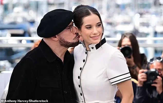 John Travolta rocks another bizarre beret at Cannes - hours after being trolled for unique new look - 2