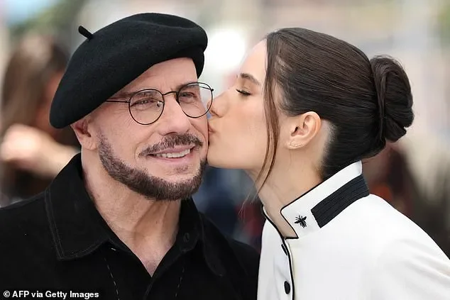 John Travolta rocks another bizarre beret at Cannes - hours after being trolled for unique new look - 1