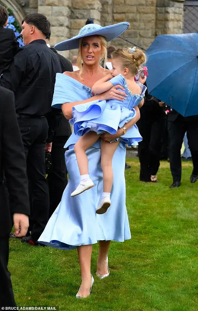 Venezuela Fury, 16, and Noah Price, 19, share a sweet kiss as they depart church with her 18 bridesmaids and famous family after 'beautiful' wedding - 1