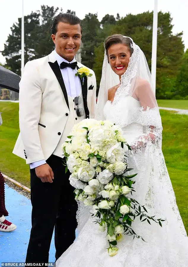 Venezuela Fury, 16, and Noah Price, 19, share a sweet kiss as they depart church with her 18 bridesmaids and famous family after 'beautiful' wedding - 2