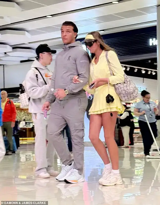 And the bride wore... yellow! Venezuela Fury, 16, changes into a crop top and mini-skirt as she arrives at the airport for her honeymoon with new husband Noah Price, 19 - 3