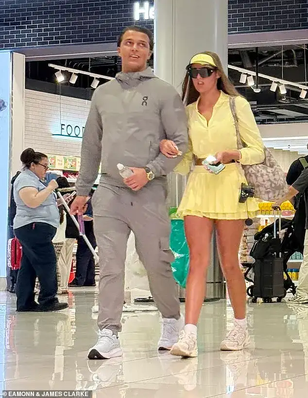 And the bride wore... yellow! Venezuela Fury, 16, changes into a crop top and mini-skirt as she arrives at the airport for her honeymoon with new husband Noah Price, 19 - 2