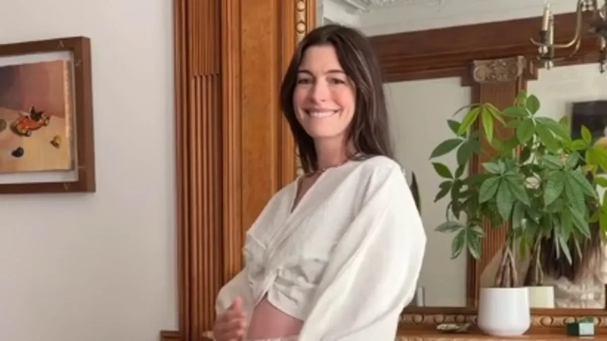 Pregnant Anne Hathaway flashes her blossoming baby bump as she steps out in NYC before later appearing in glamorous yellow velvet gown - 1