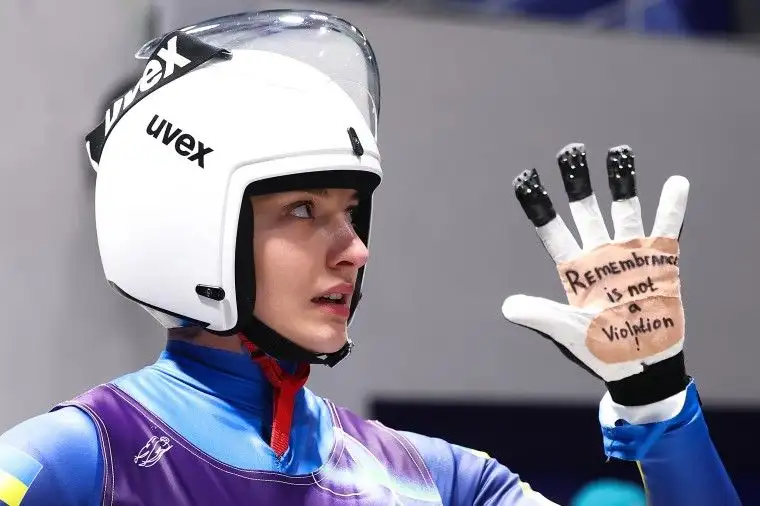 ‘Moment of shame’: Ukrainian athlete disqualified over helmet - 3