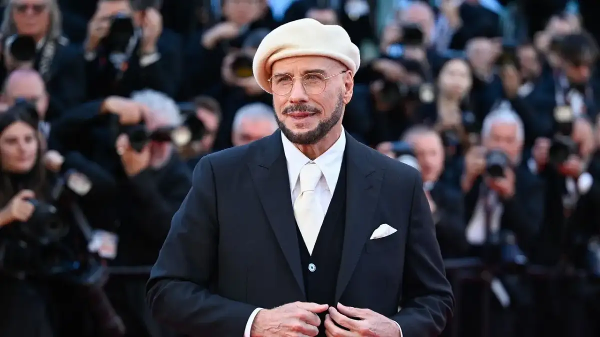 John Travolta rocks another bizarre beret at Cannes - hours after being trolled for unique new look - 3