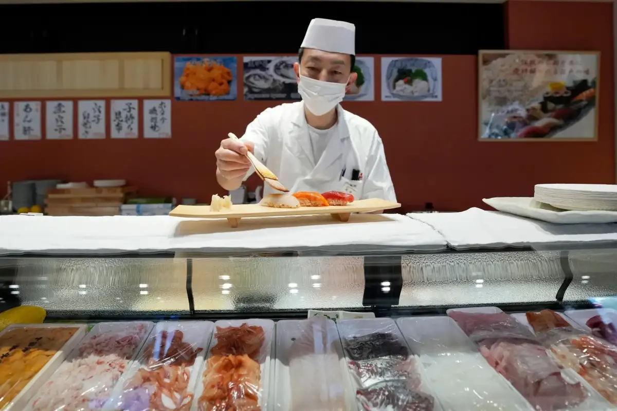Japan avoids recession with weak return to growth – business live - 2