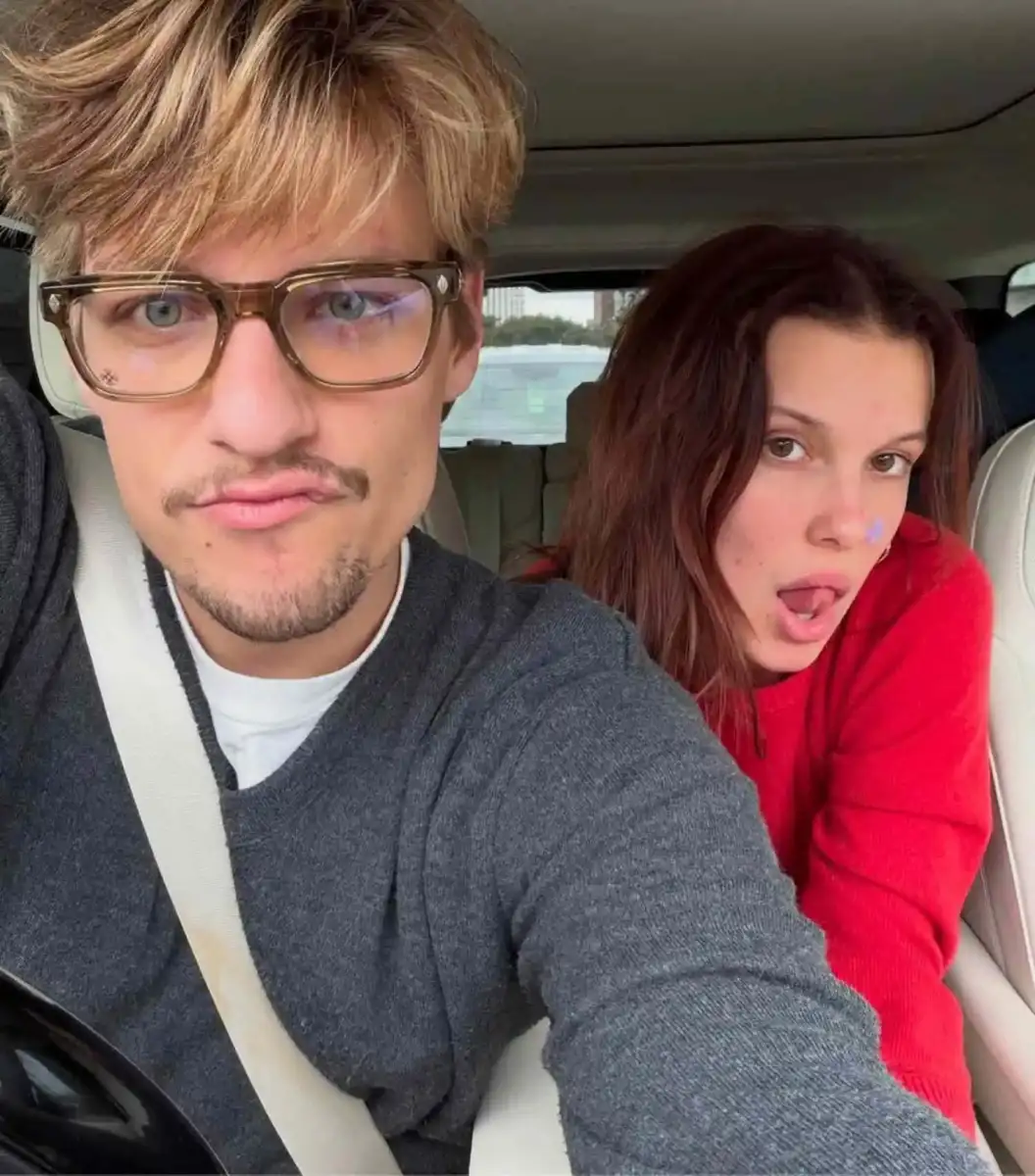 Millie Bobby Brown forces a smile with Jake Bongiovi on her 22nd birthday months after welcoming first child - 1