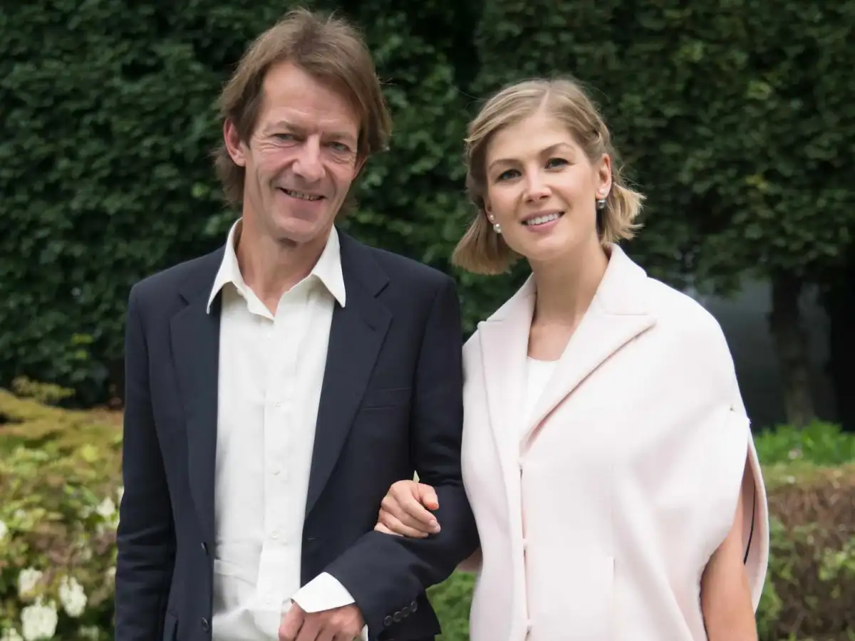 Rosamund Pike, 47, makes a rare appearance with her partner Robie Uniacke 65, at the Olivier Awards after hinting they have secretly married - 2
